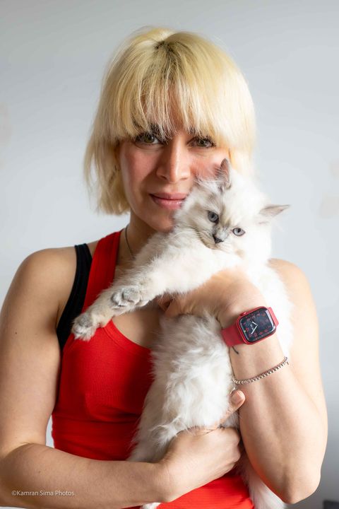 Sima hugging a cat